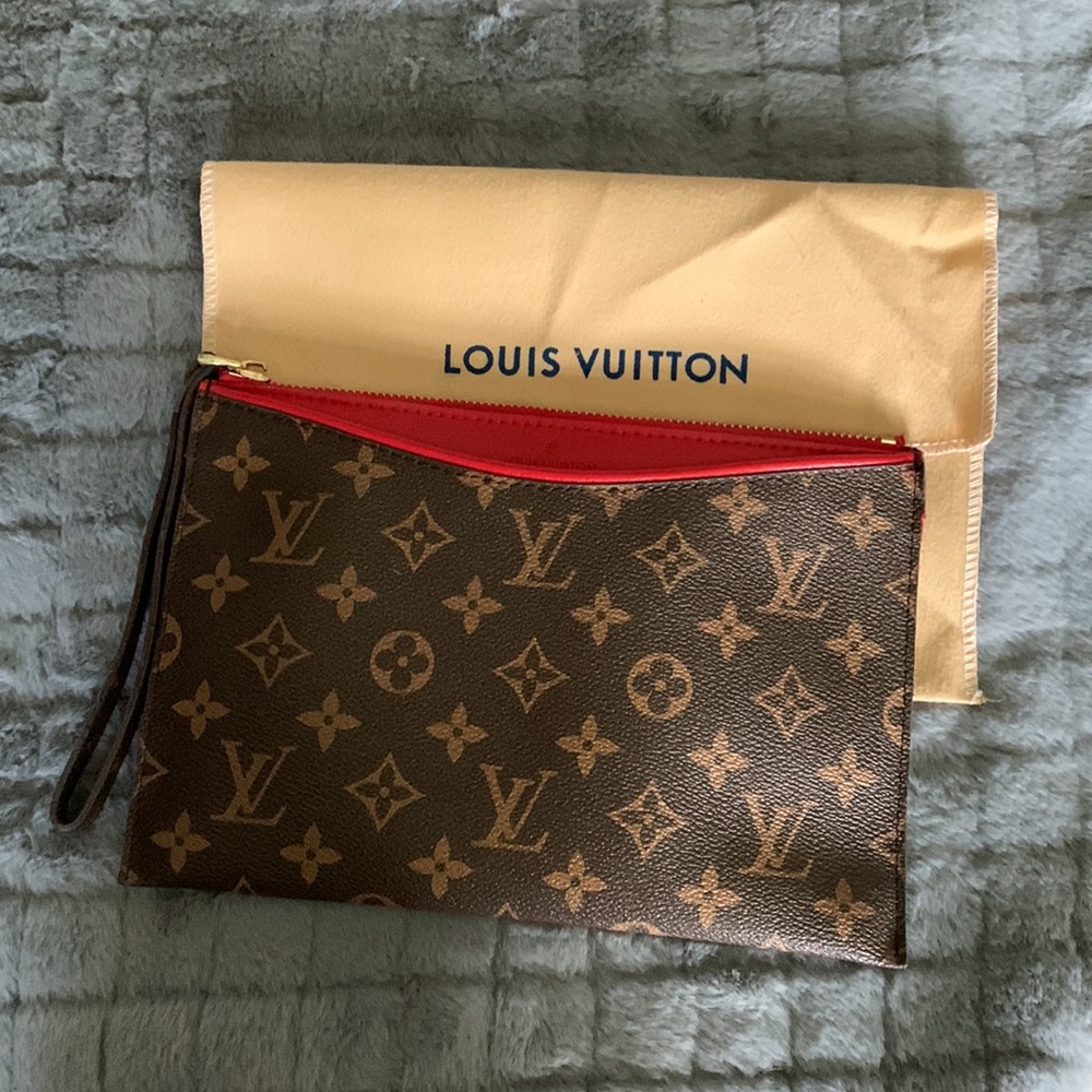 LV wristlet with red interior